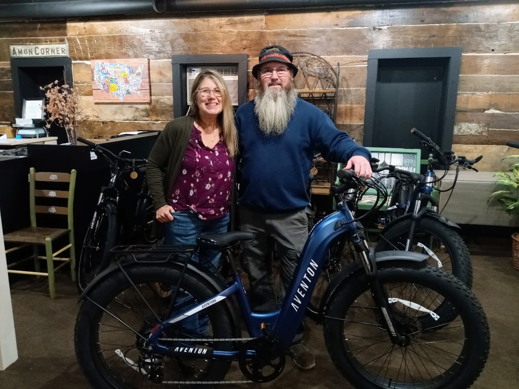 A man and a woman with an e-bike